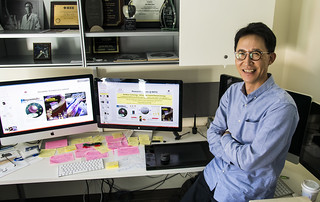 Dr. Kim in front of computer